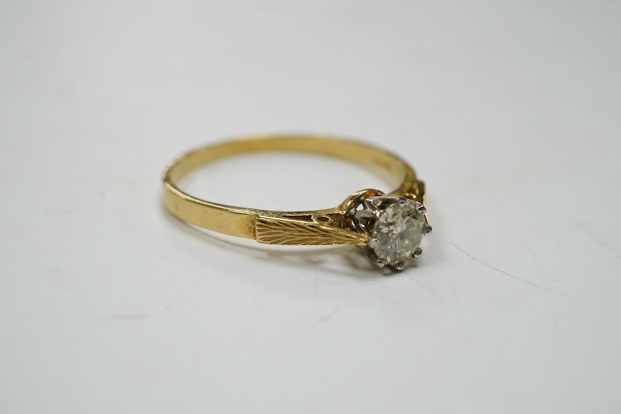 A modern 18ct gold and solitaire diamond set ring, size V, gross weight 3.1 grams. Condition - fair